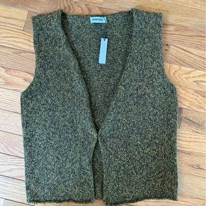 Green knit vest by Rumored